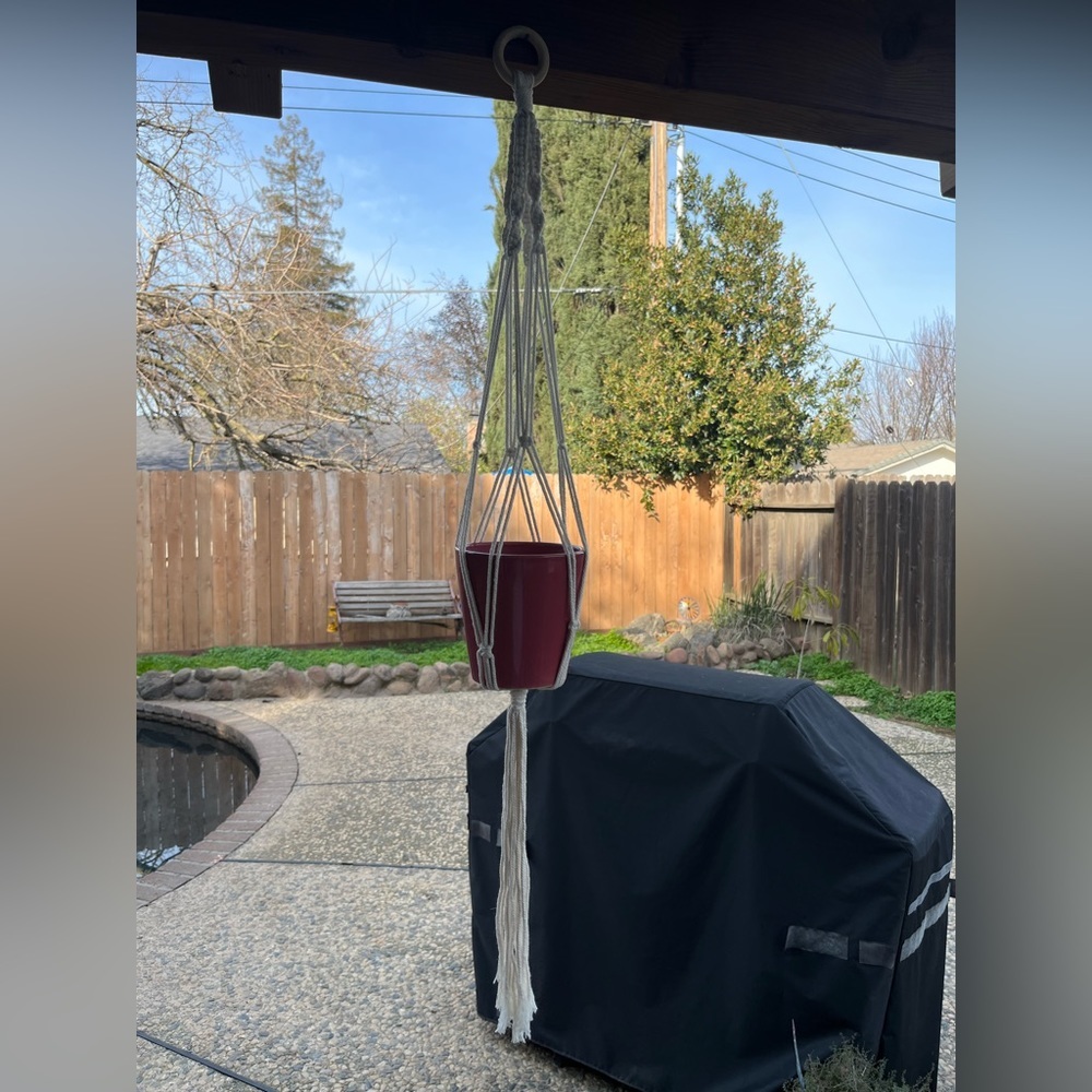 Macrame flowerpot hanger.